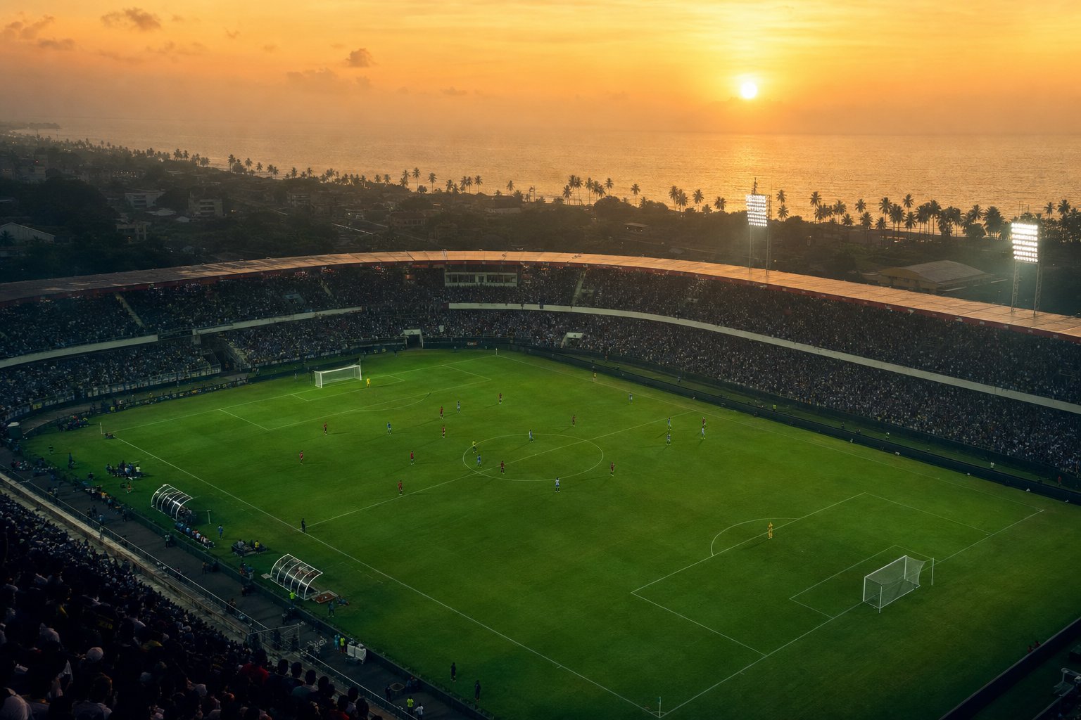Estadio de fútbol en la costa ecuatoriana al atardecer, con las gradas llenas